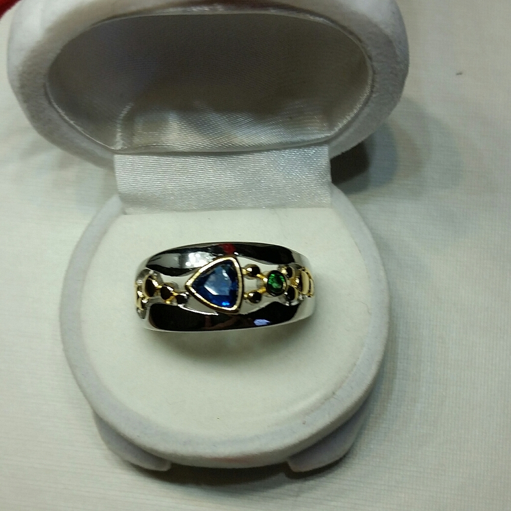 Silver band with  sapphire blue, green, silver, & gold accents marked 925